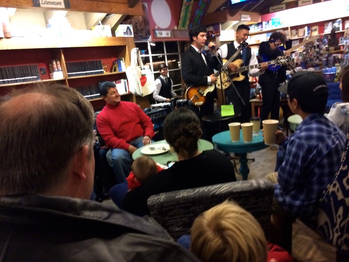 Daddy and C listening to music in the coffee shop