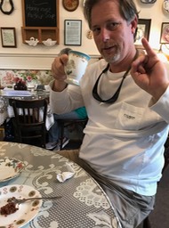 Travis demonstrates the proper way to drink tea
